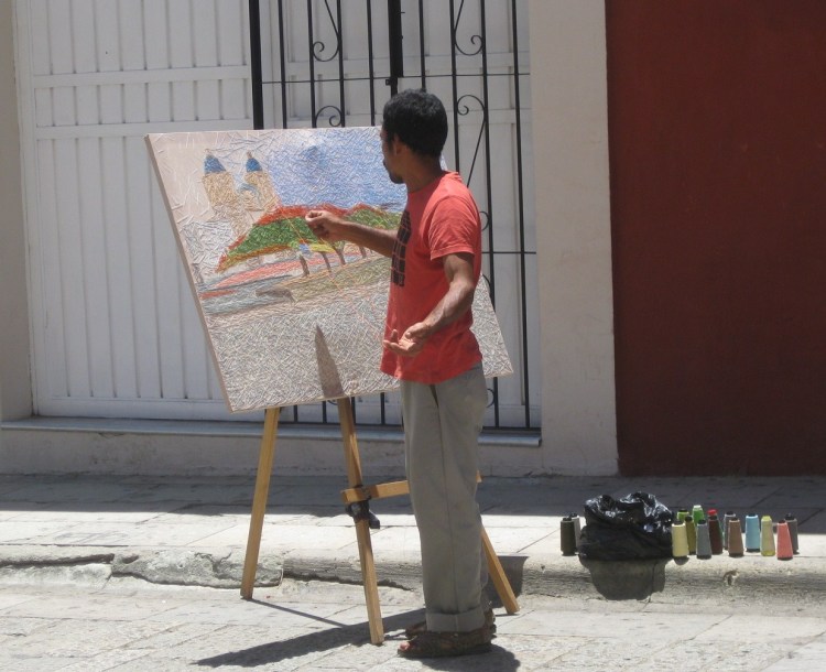 Oaxacan street artist performing his craft. 